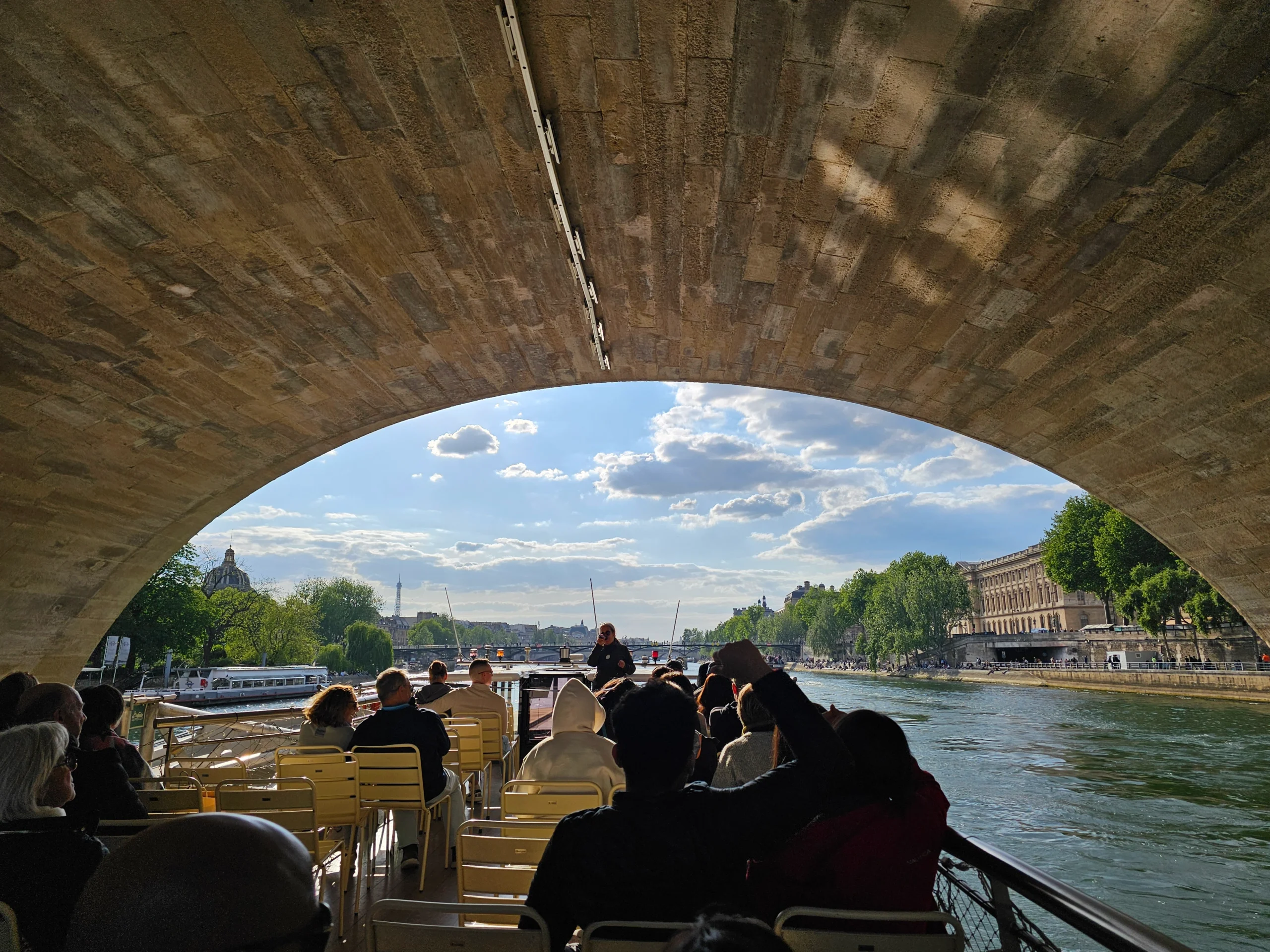 Boat going under bridge during Seine River cruise