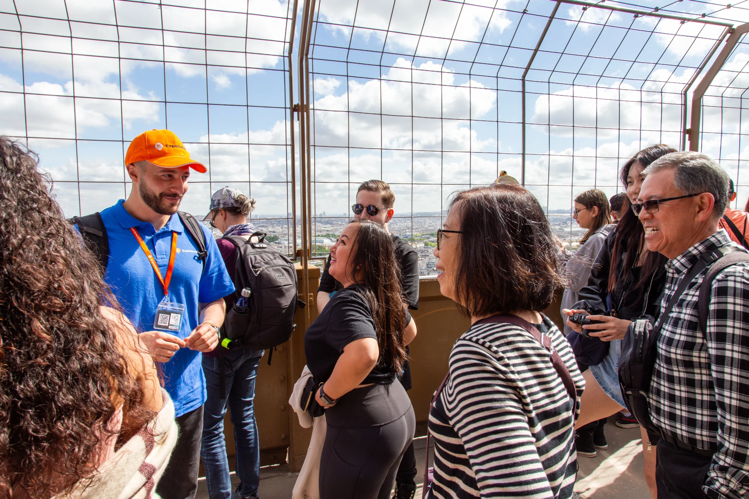 Guide interacting with travelers during Eiffel Tower Guided Tower in Paris