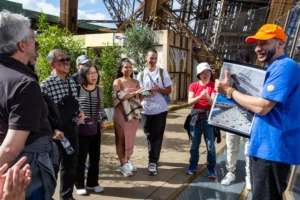 Tour guide with guests during Eiffel Tower guided tour in Paris