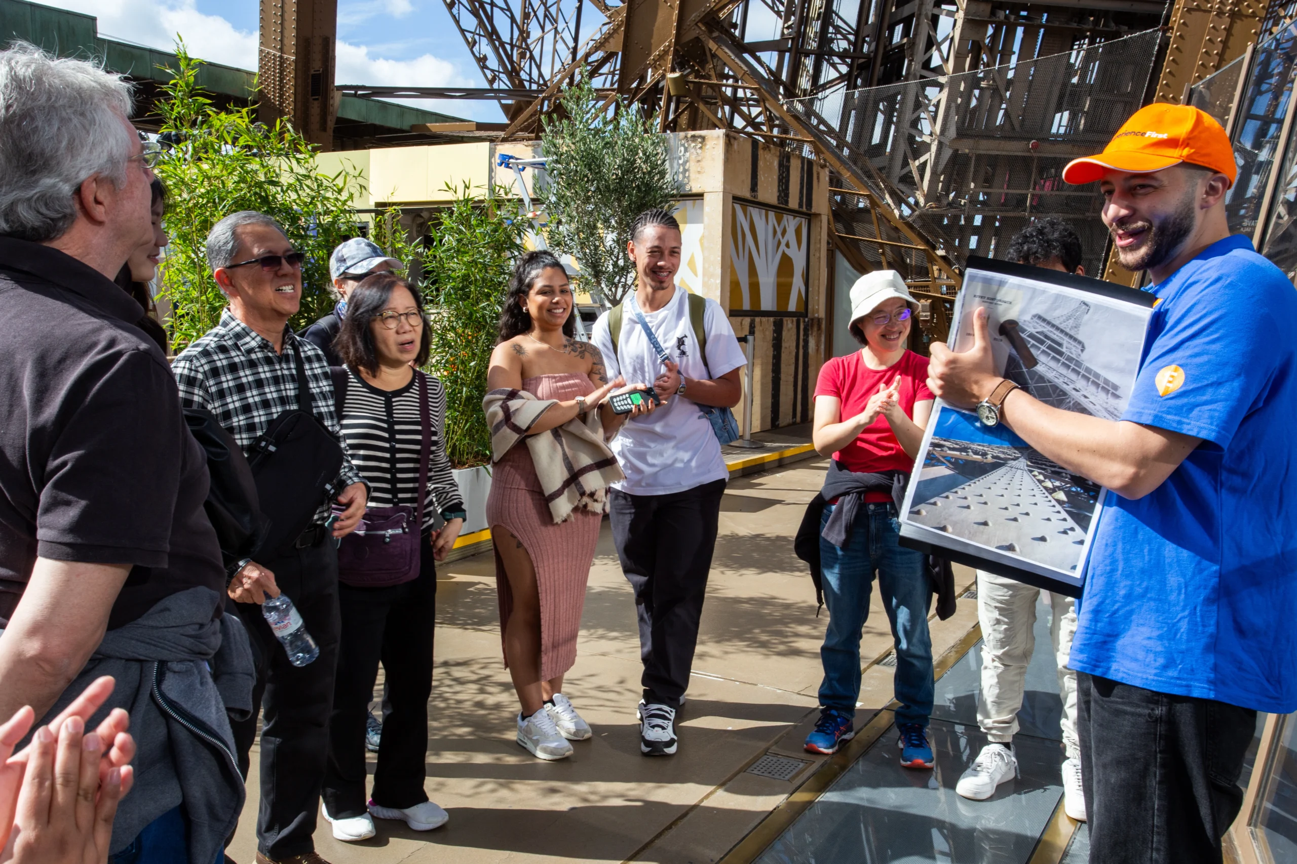Tour guide with guests during Eiffel Tower guided tour in Paris