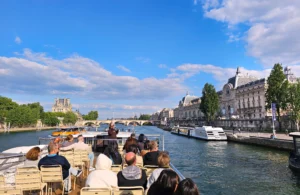 View of passengers on Seine River Cruise on a sunny day in Paris France