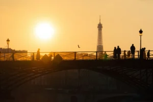 Silhouette of people near the River Seine in Paris during sunset