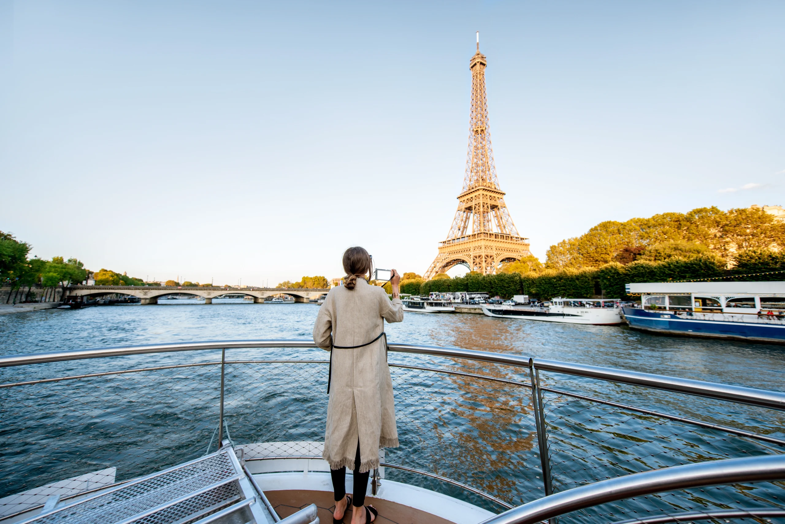 Woman admiring the Eiffel Tower from River Seine Cruise during Private Paris guided tour