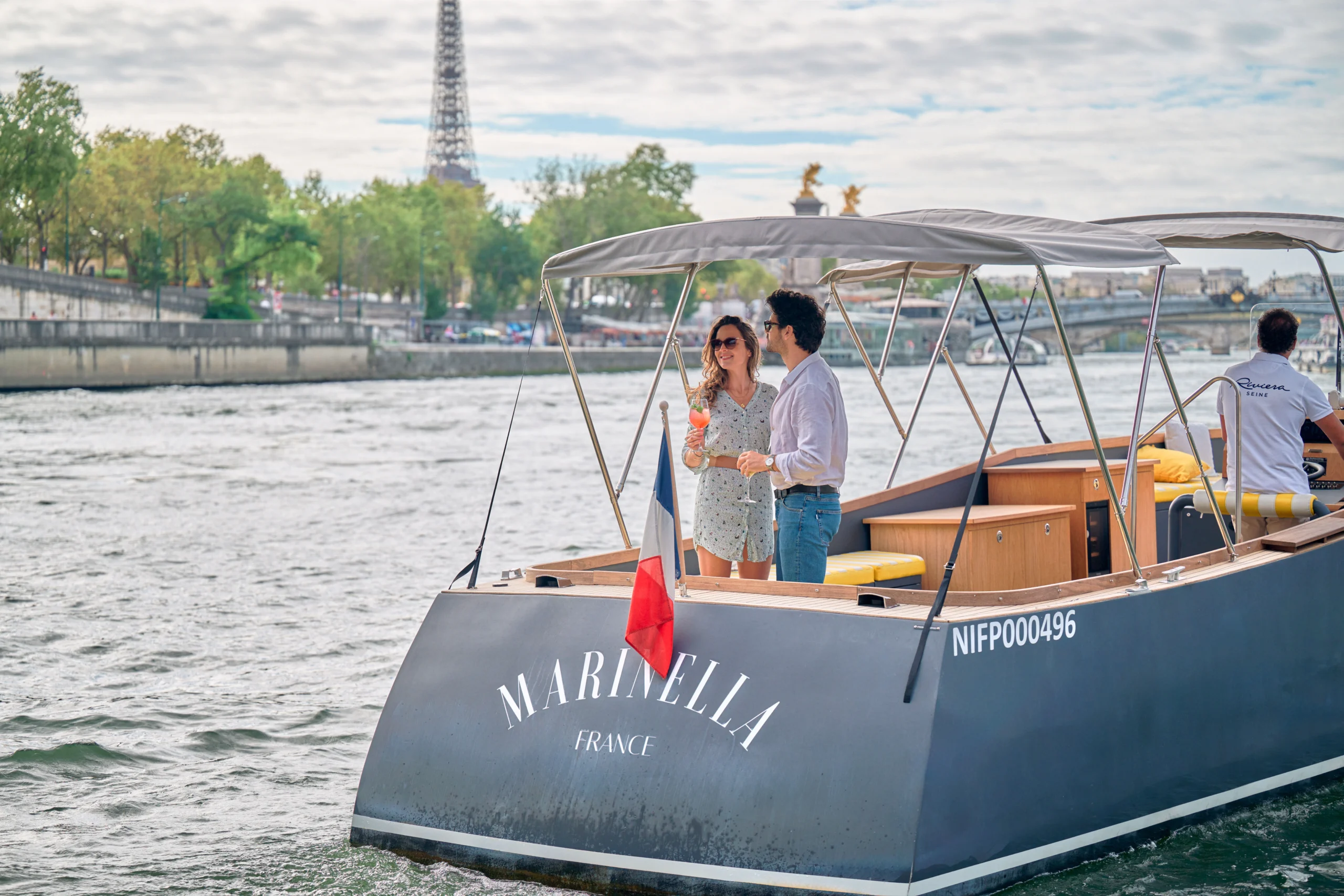 Couple admiring river views during Seine river experience