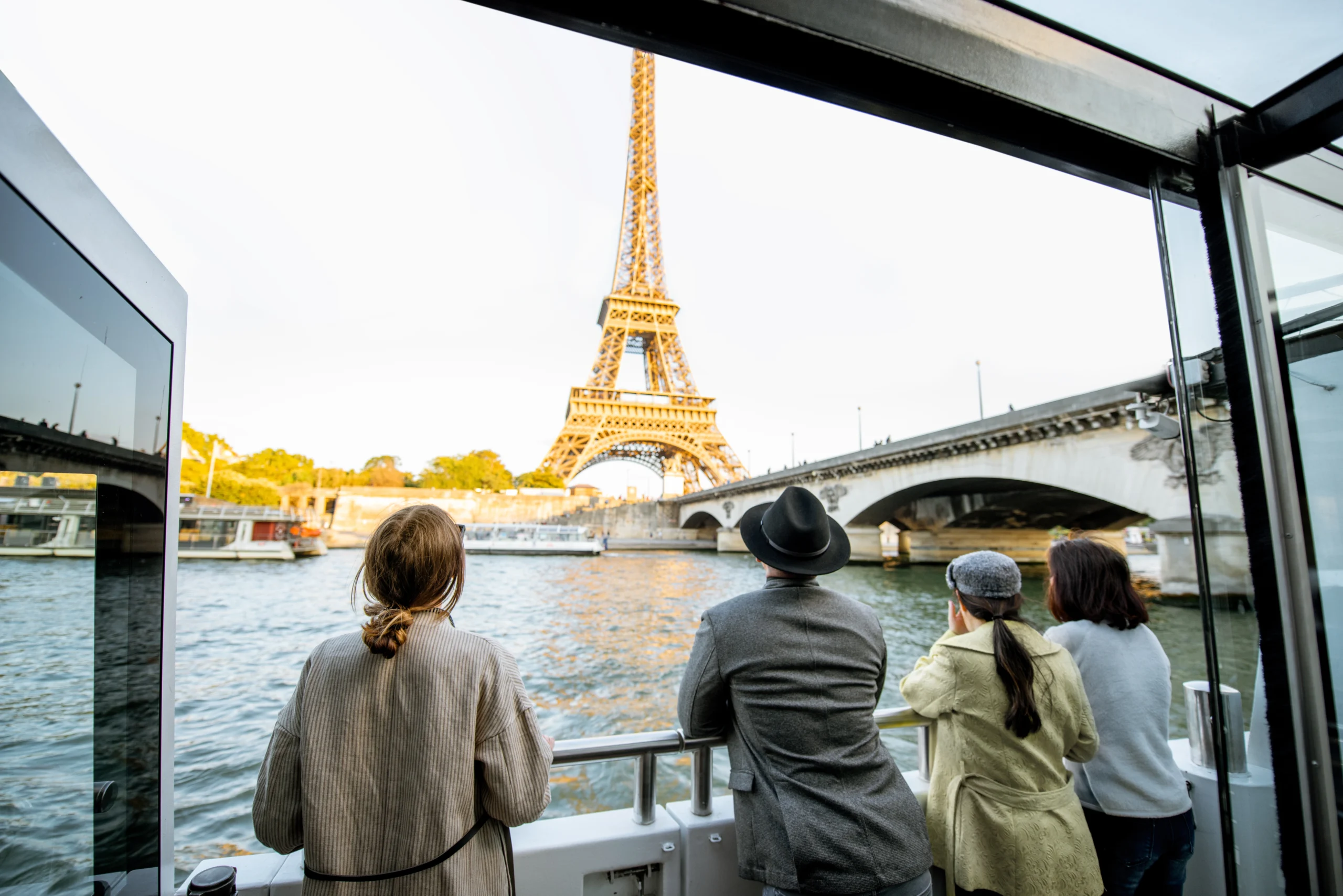 People enjoying beautiful landscape view during guided Seine cruise in Paris